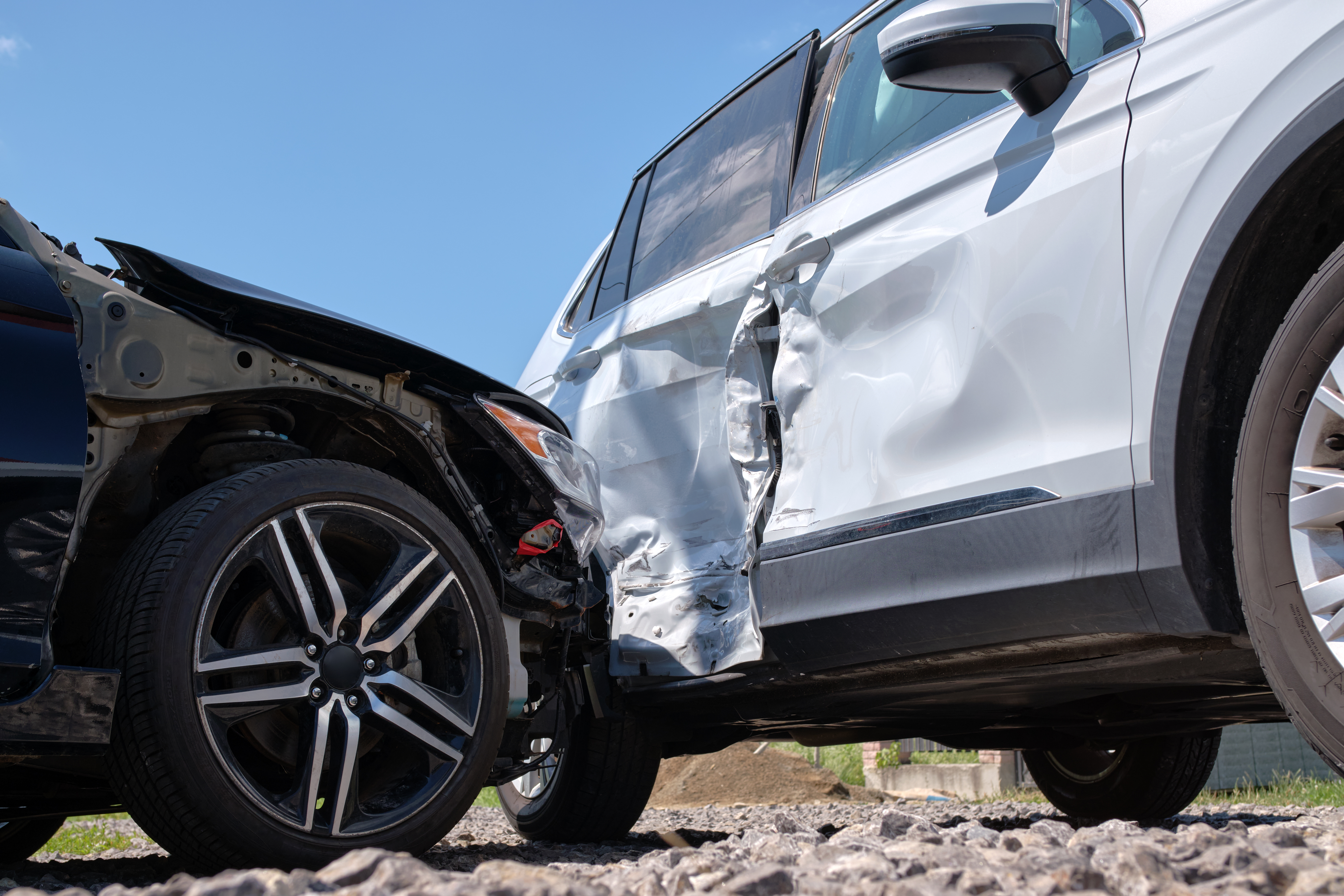 Cars crashed heavily in road accident after collision on city street Road safety and insurance concept