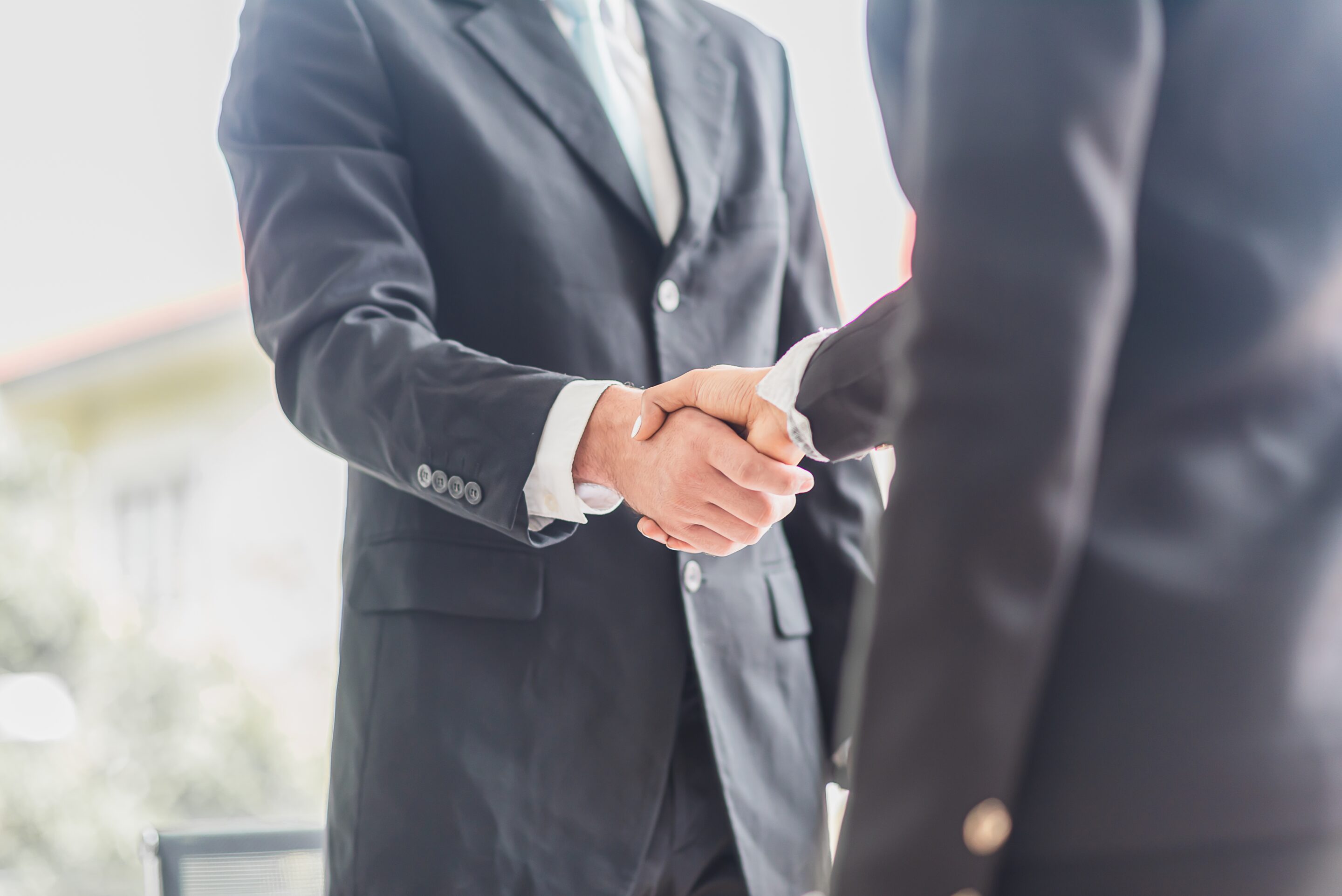 Business man shake hands with business women agreeing on partner