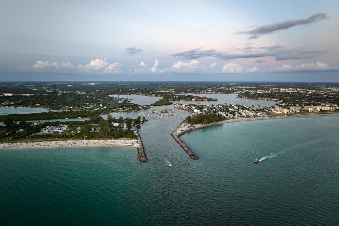 Aerial evening seascape with Nokomis sandy beach in Sarasota County USA Many tourists enjoing summer vacation time swimming in warm Mexico gulf water and sunbathing on hot Florida sun Venice Personal Injury